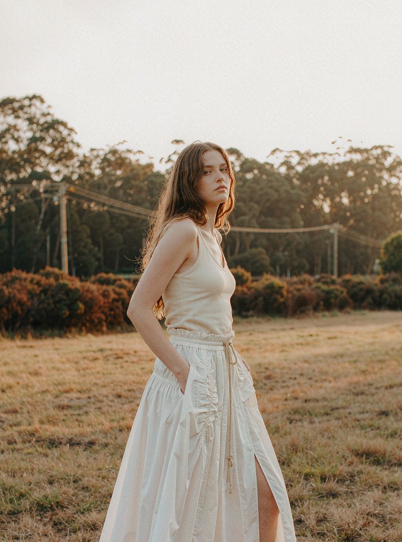 Prairie Midi Skirt — White, modelled outdoors